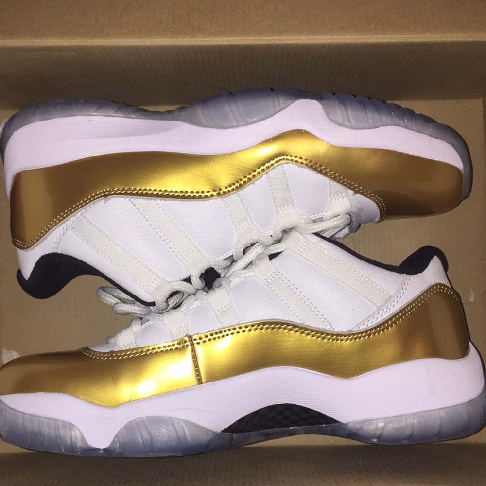 Gold & Whit Jordan 11’s